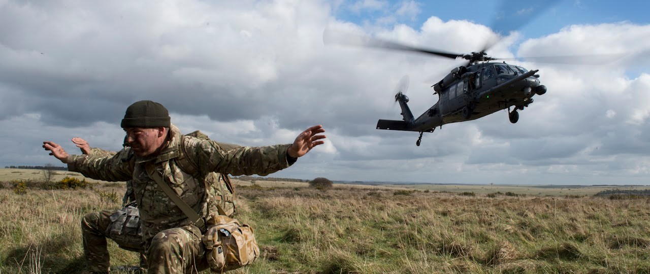 Image of a service man and helicopter